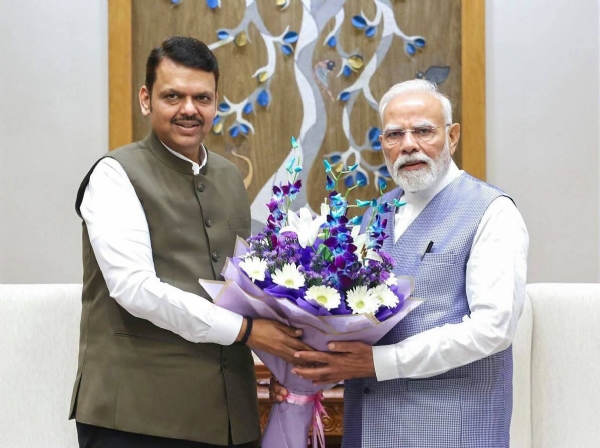 अ