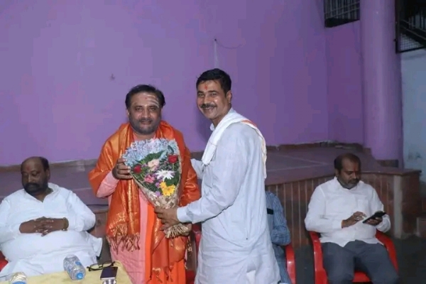 अ