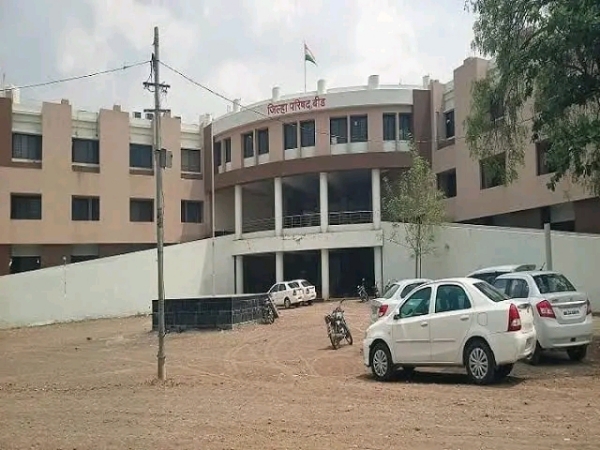 अ