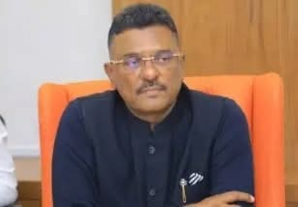 अ