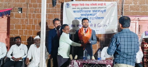 अ