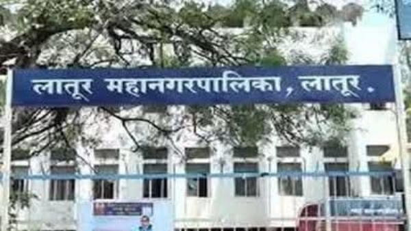 अ