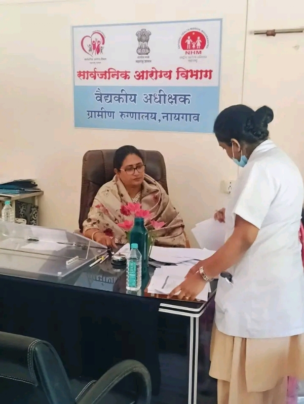 अ