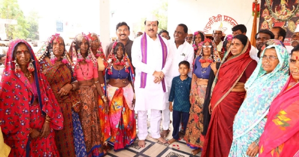 अ