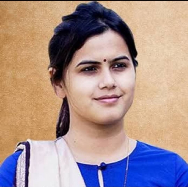 अ