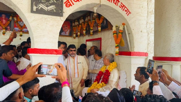 अ