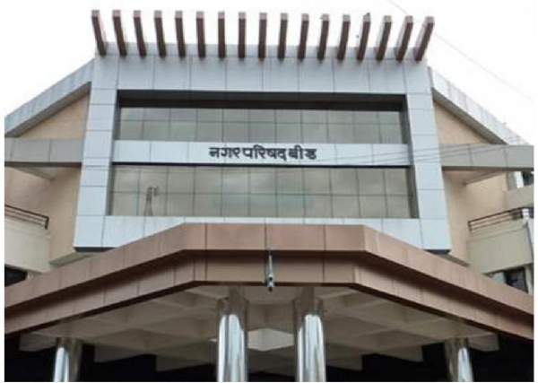 अ