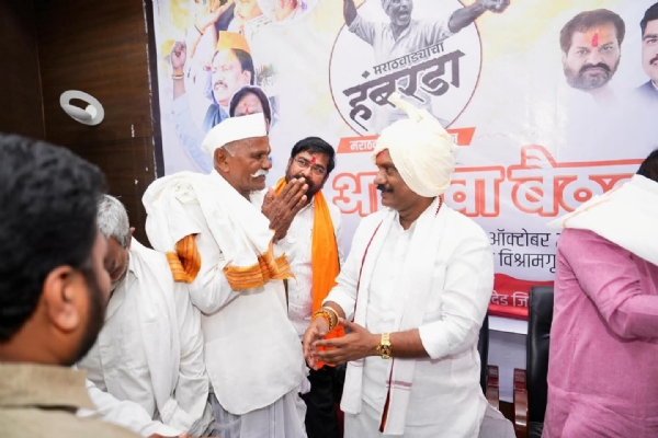 अ