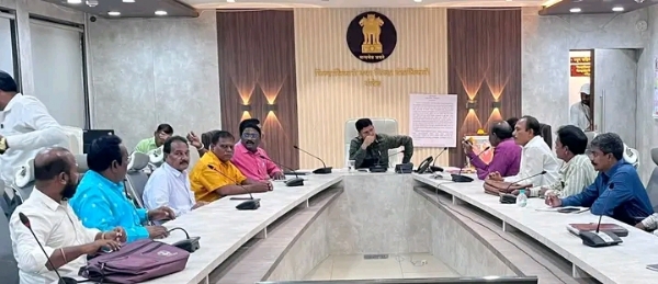 अ
