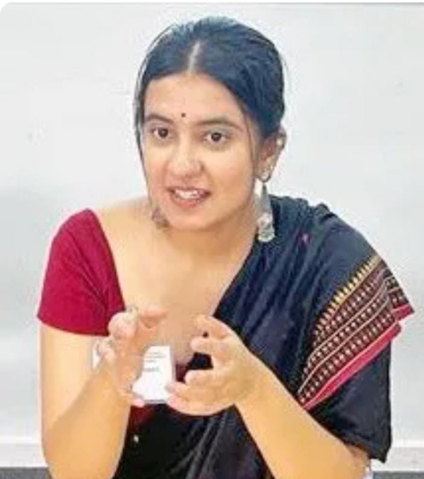 अ