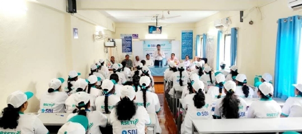 अ