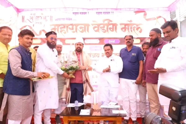 अ