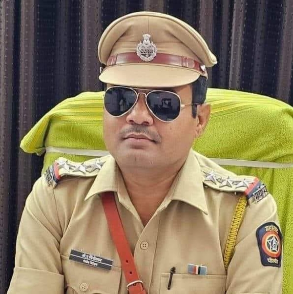 अ