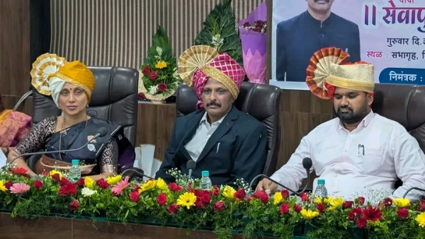 अ