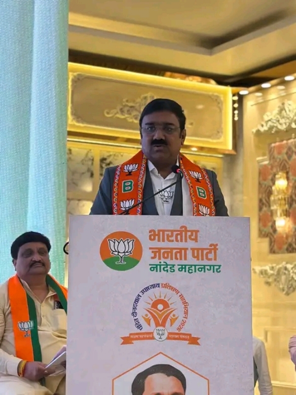 अ