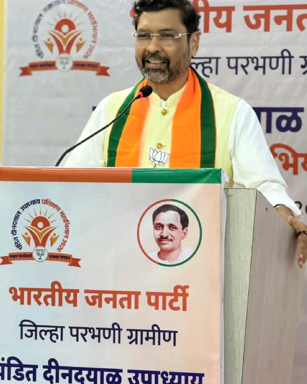 अ