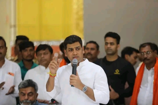 अ