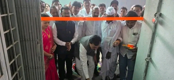 अ