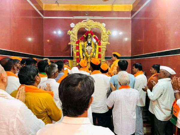 अ