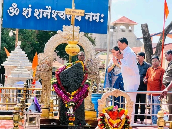 अ