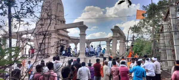 अ
