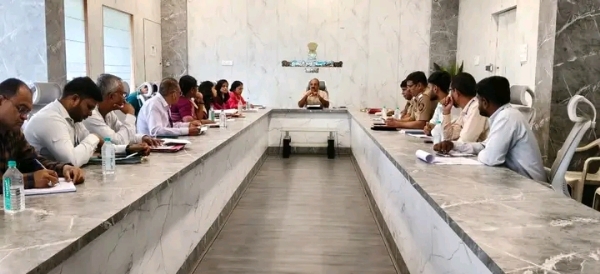 अ