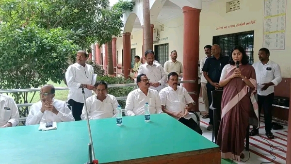 अ