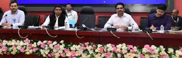 अ