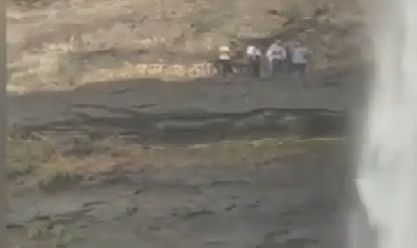 Tourists on a dangerous path; ban at Zenith Waterfall proves ineffective.