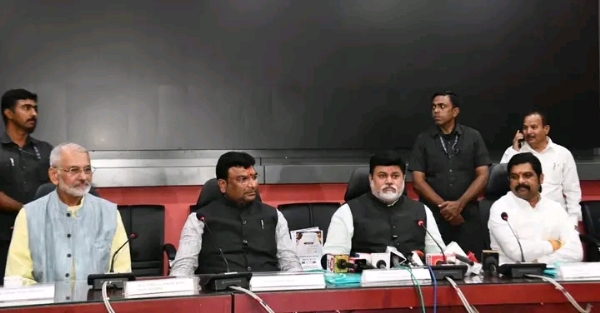अ