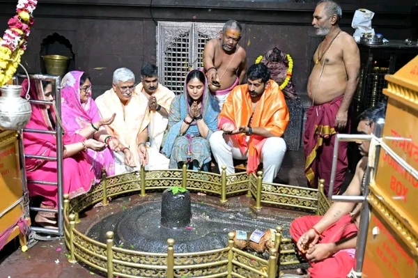 अ