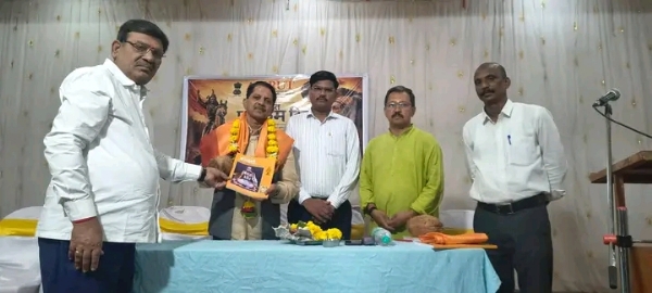 अ