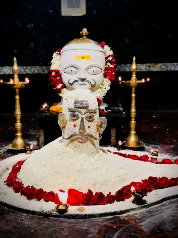 अ