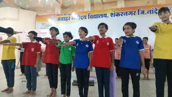 अ