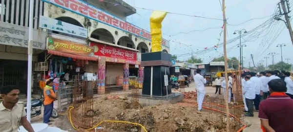 अ