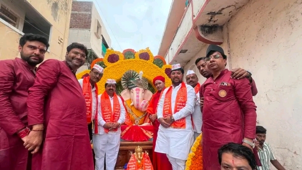अ