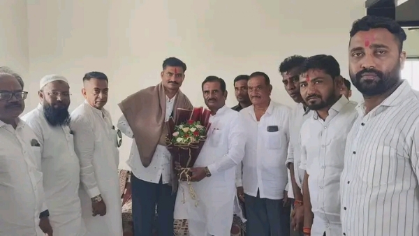 अ