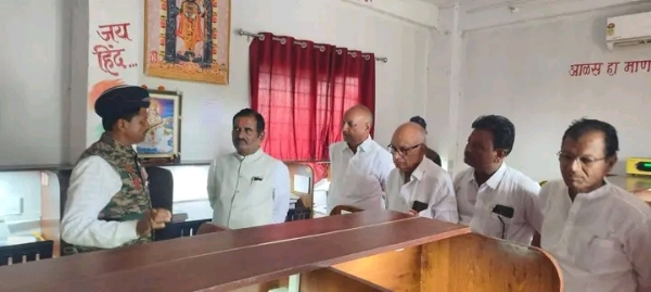 अ