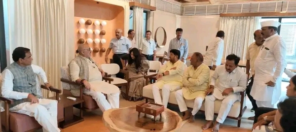 अ