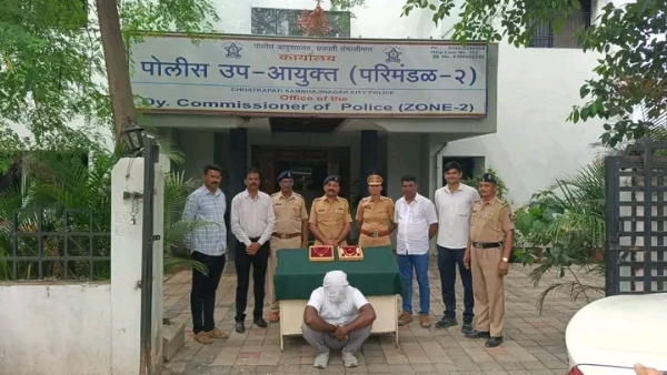 अ