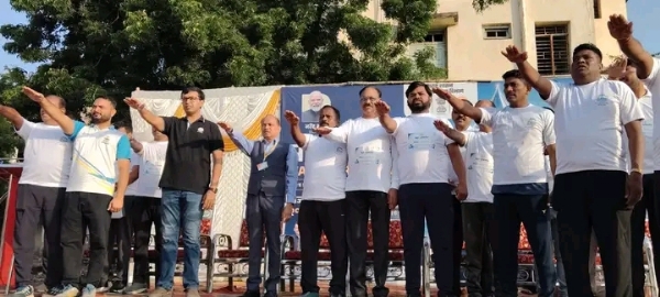 अ