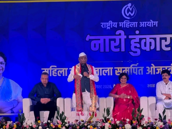 अ