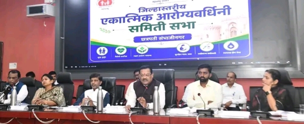 अ