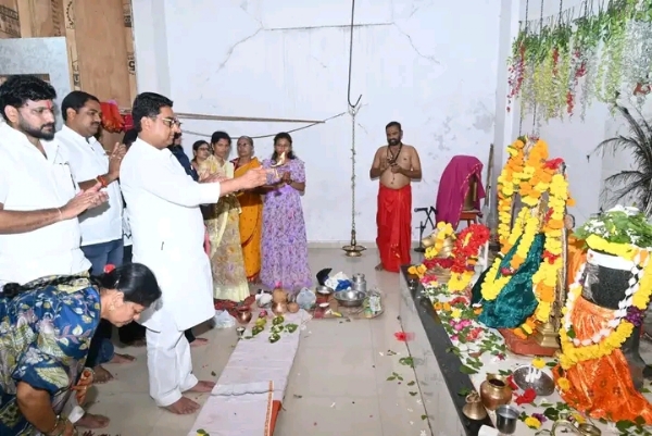 अ