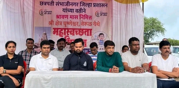 अ