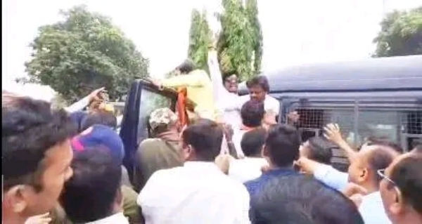 अ