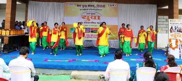 अ