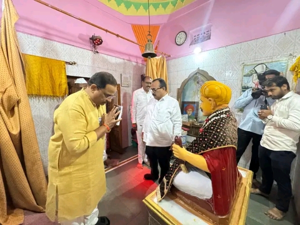 अ