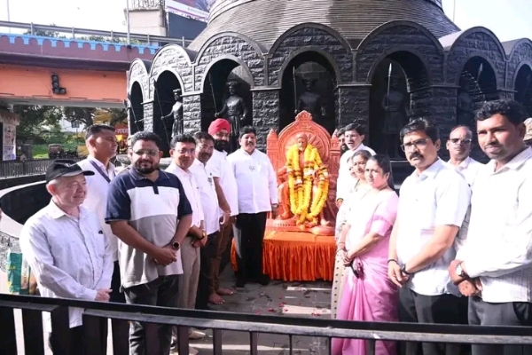 अ