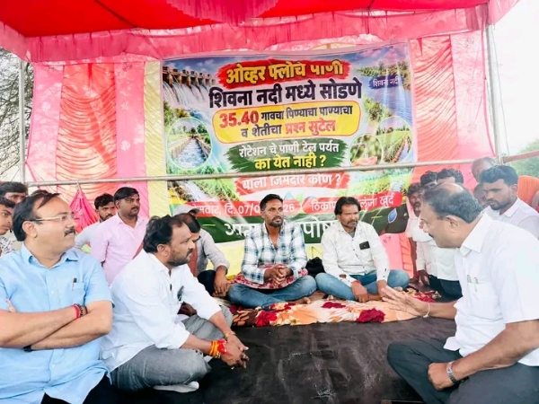 अ